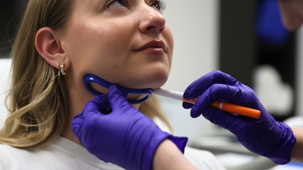 Person getting prepped for chin fat reduction