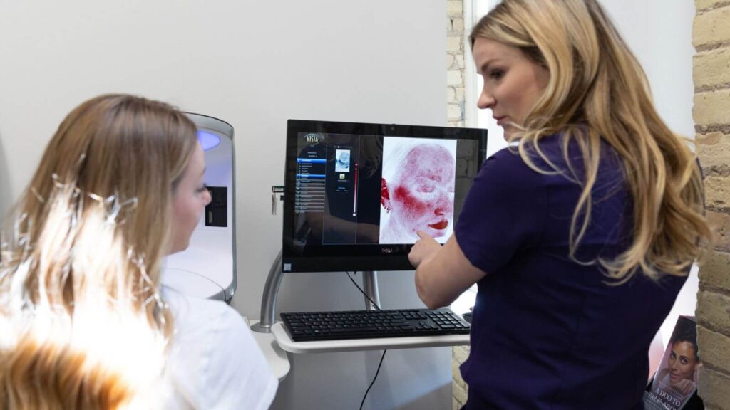 Patient looking at skin analysis