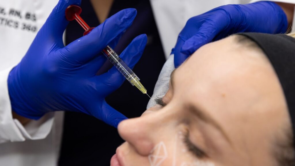 Person getting under-eye treatment