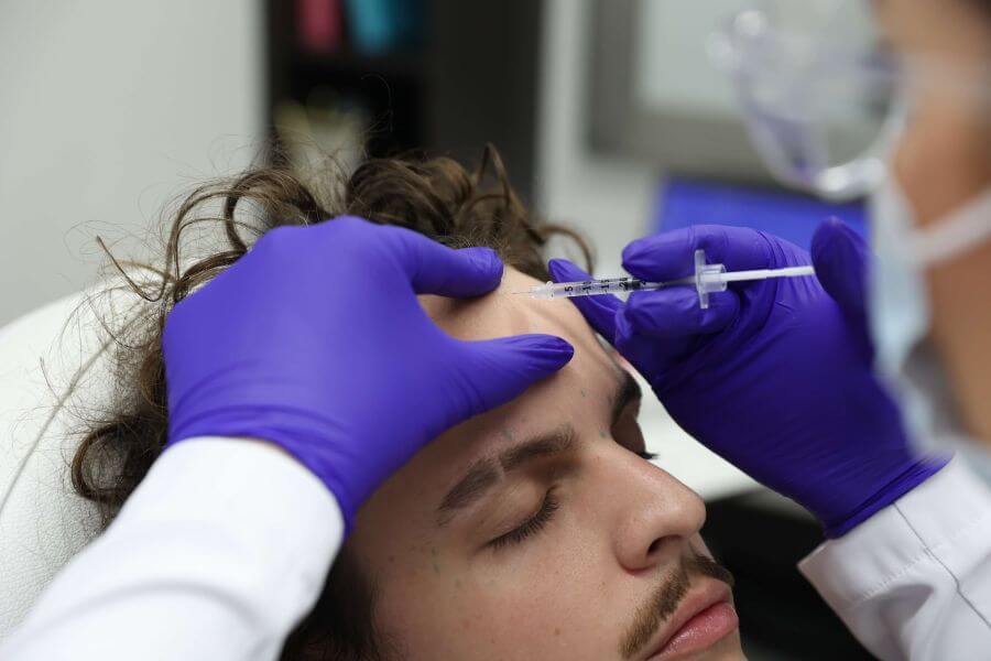 man receiving boxton on face closeup (2)