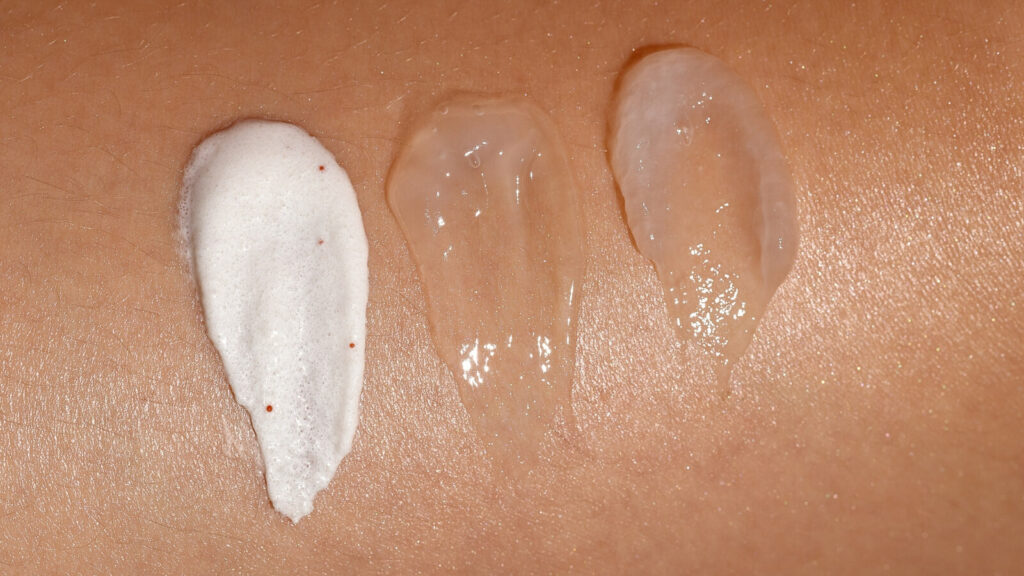 3 different exfoliating products on skin