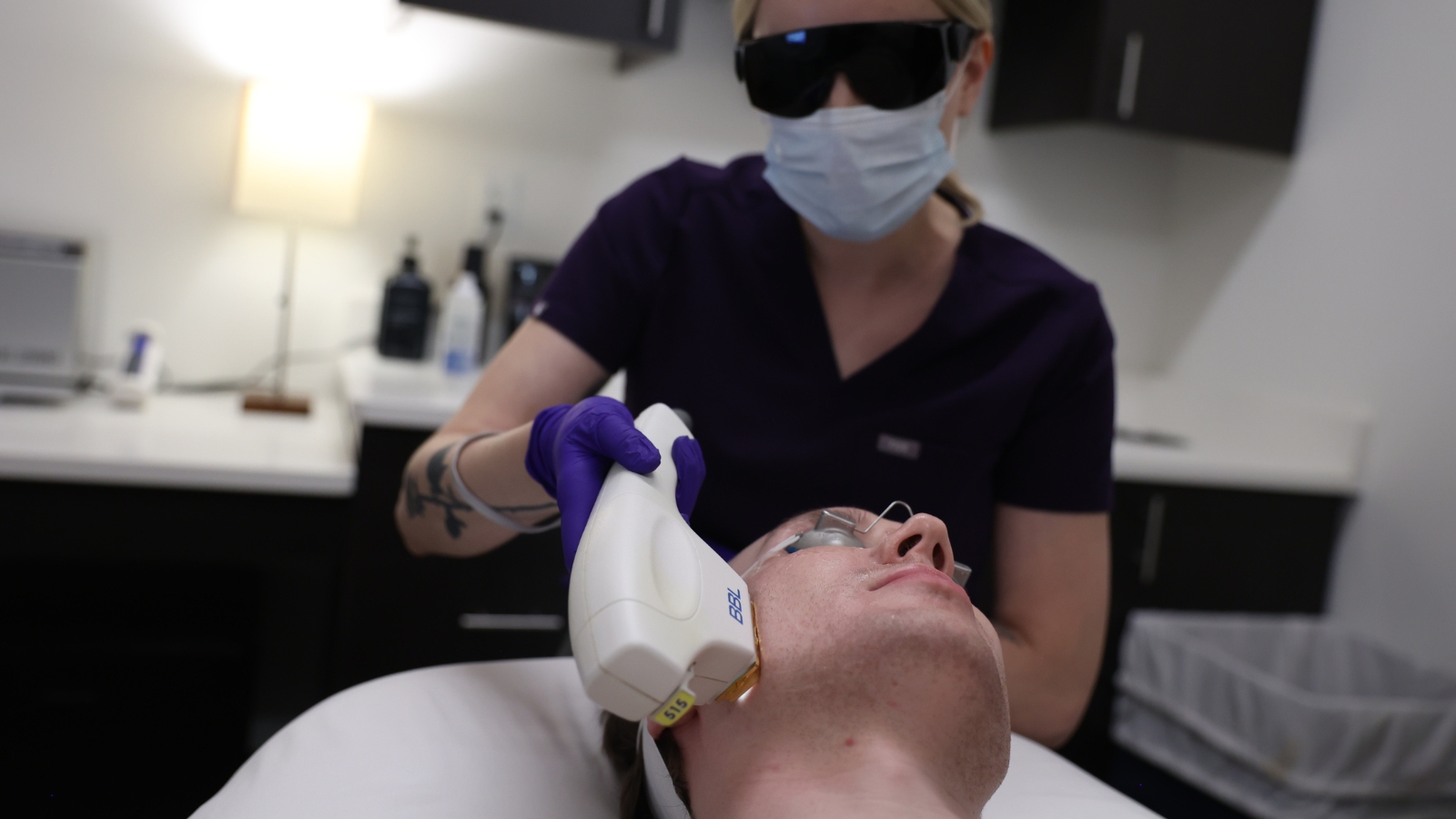 Male getting laser hair removal treatment