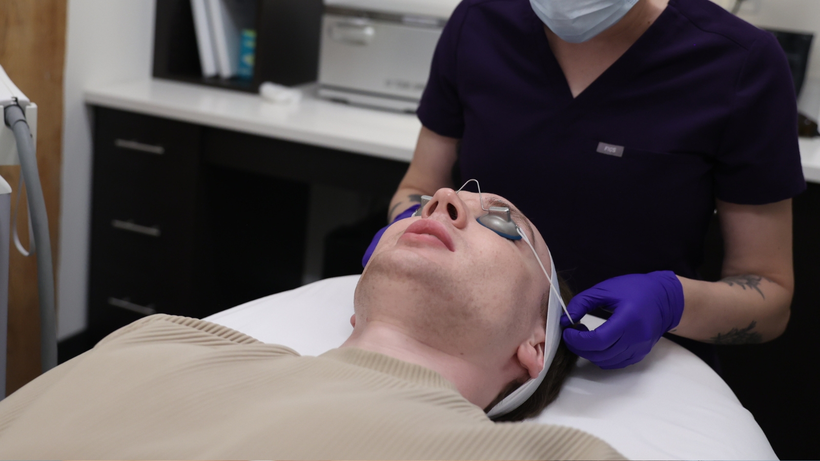 Male getting prepped for laser hair removal treatment