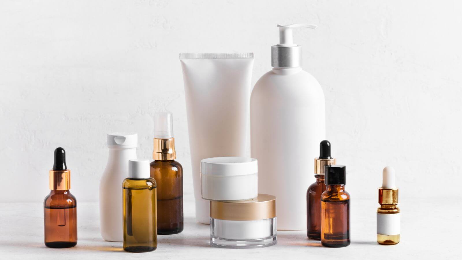close up of skincare serums creams and oils