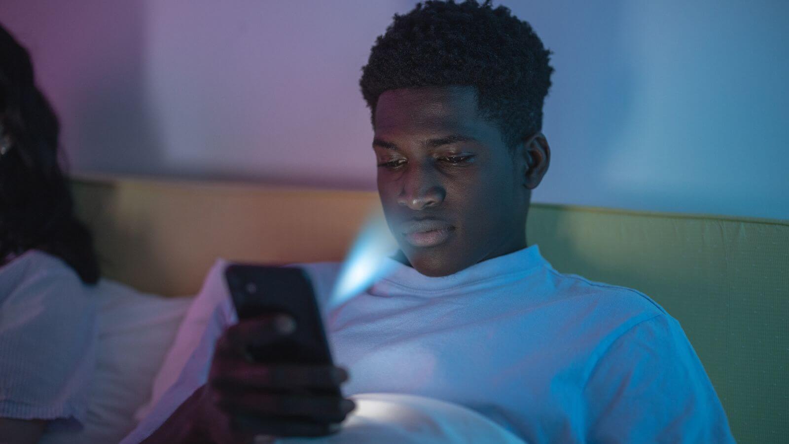 man looking at phone